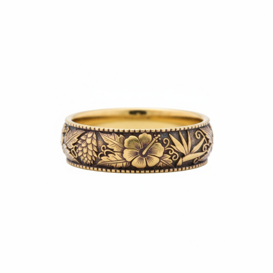 Hawaiian flower wedding band in 14K yellow gold with dark antique patina and botanical engraving | Rare Earth Jewelry