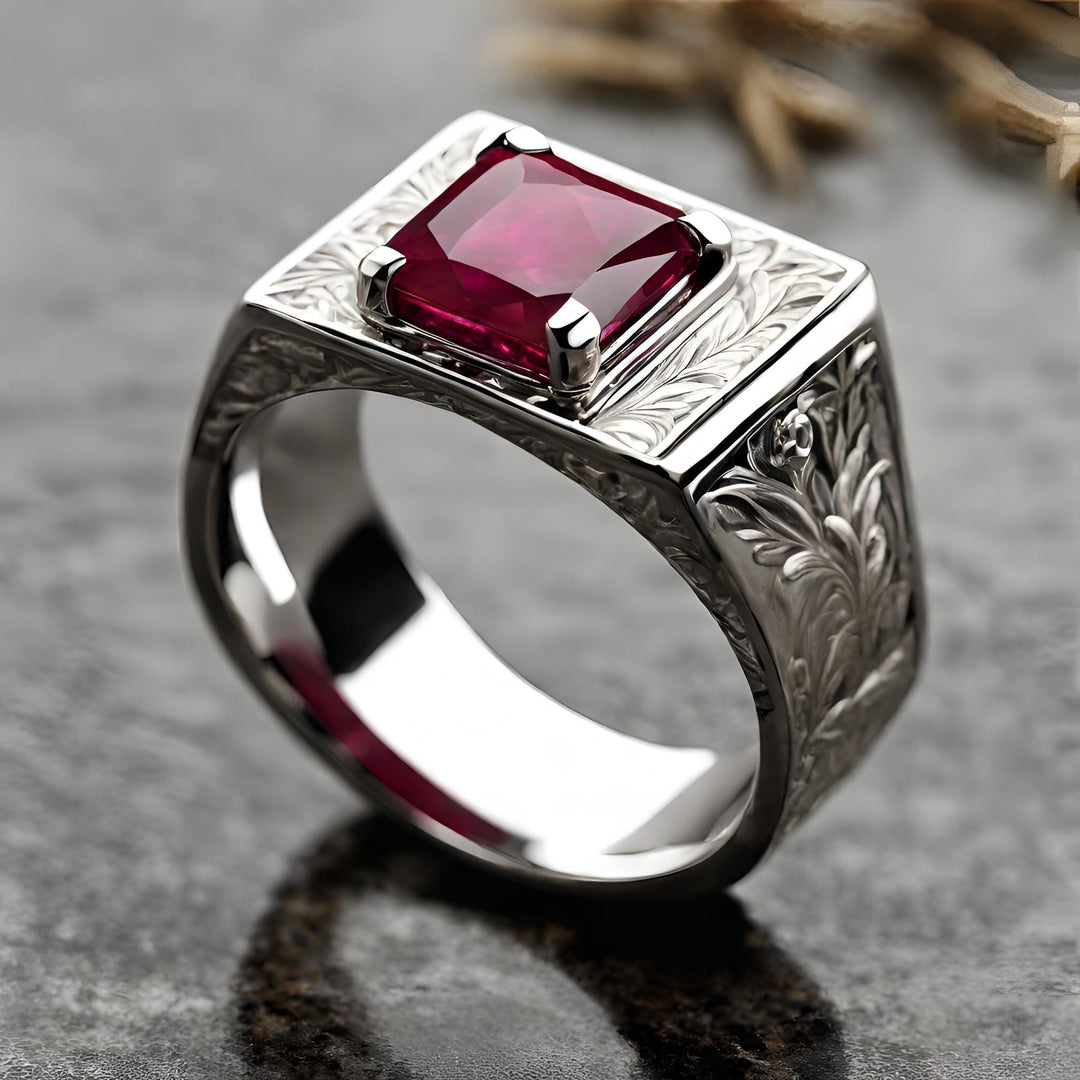 A vintage style men's ruby ring with an engraved design and a large square ruby in 14K Gold from Rare Earth Jewelry.