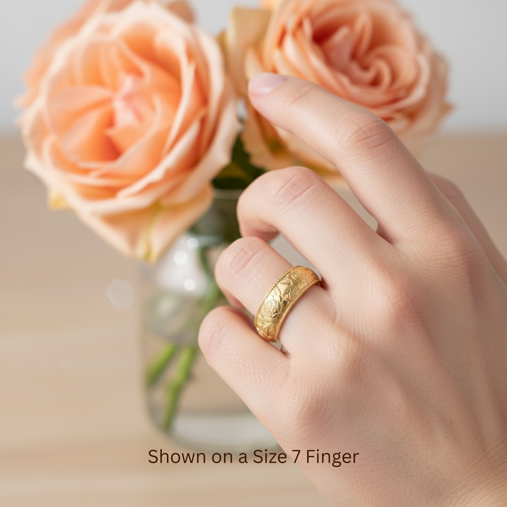 Yellow gold engraved rose ring on hand, 8mm floral wedding band with rose motif | Rare Earth Jewelry
