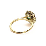Vintage style oval halo ring mounting diamond accents in yellow gold.