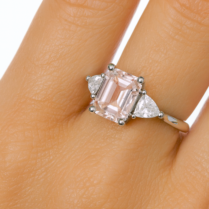 Close up of Vintage Style Morganite 3 Stone Ring on the Finger | Natural Pink Gemstone Ring, Emerald Cut Morganite Engagement Ring | Rare Earth Jewelry