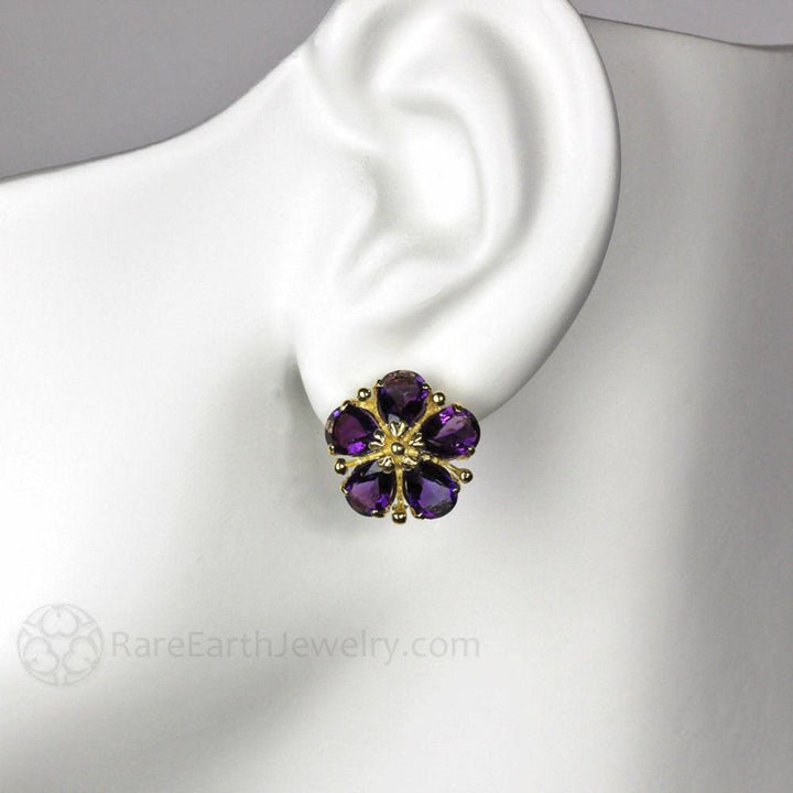 14K Gold Amethyst Flower Earrings Flower Shaped Earrings shown on the ear model