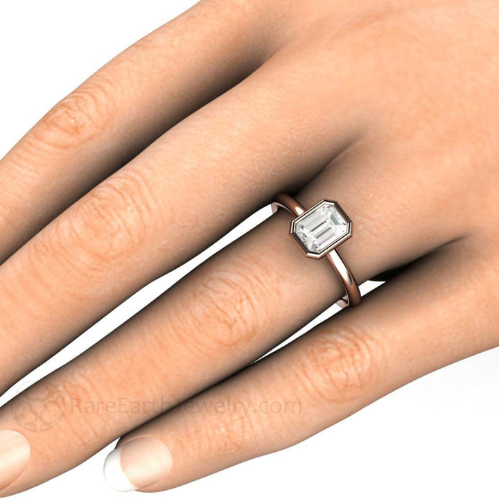 1ct Emerald Cut Diamond Engagement Ring,  Bezel Set Solitaire shown on the Hand