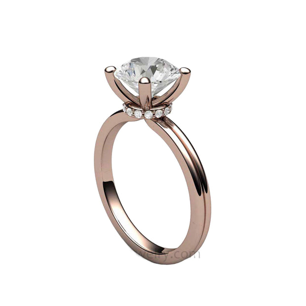 A 2 Carat Moissanite Solitaire Engagement Ring with an 8mm Forever One Moissanite and Hidden Diamonds in the Gallery, shown in Rose Gold from Rare Earth Jewelry