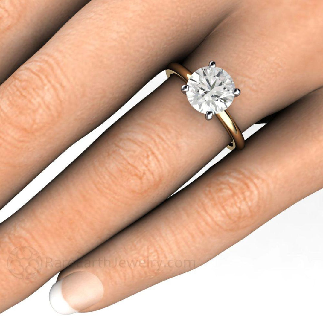 2 Carat Moissanite Solitaire Engagement Ring on the Hand, Classic Four-Prong Design in Gold and Platinum