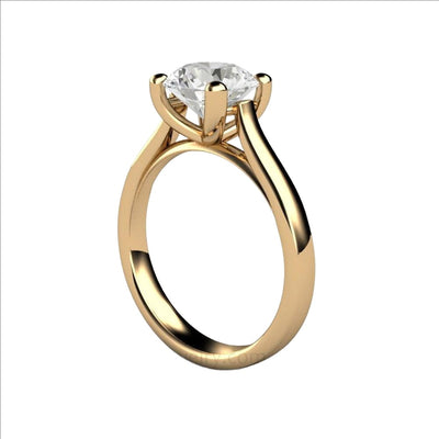 A classic 4 prong solitaire engagement ring with a 2 carat Forever One Moissanite, an ethical and affordable lab created diamond alternative, shown in yellow gold from Rare Earth Jewelry