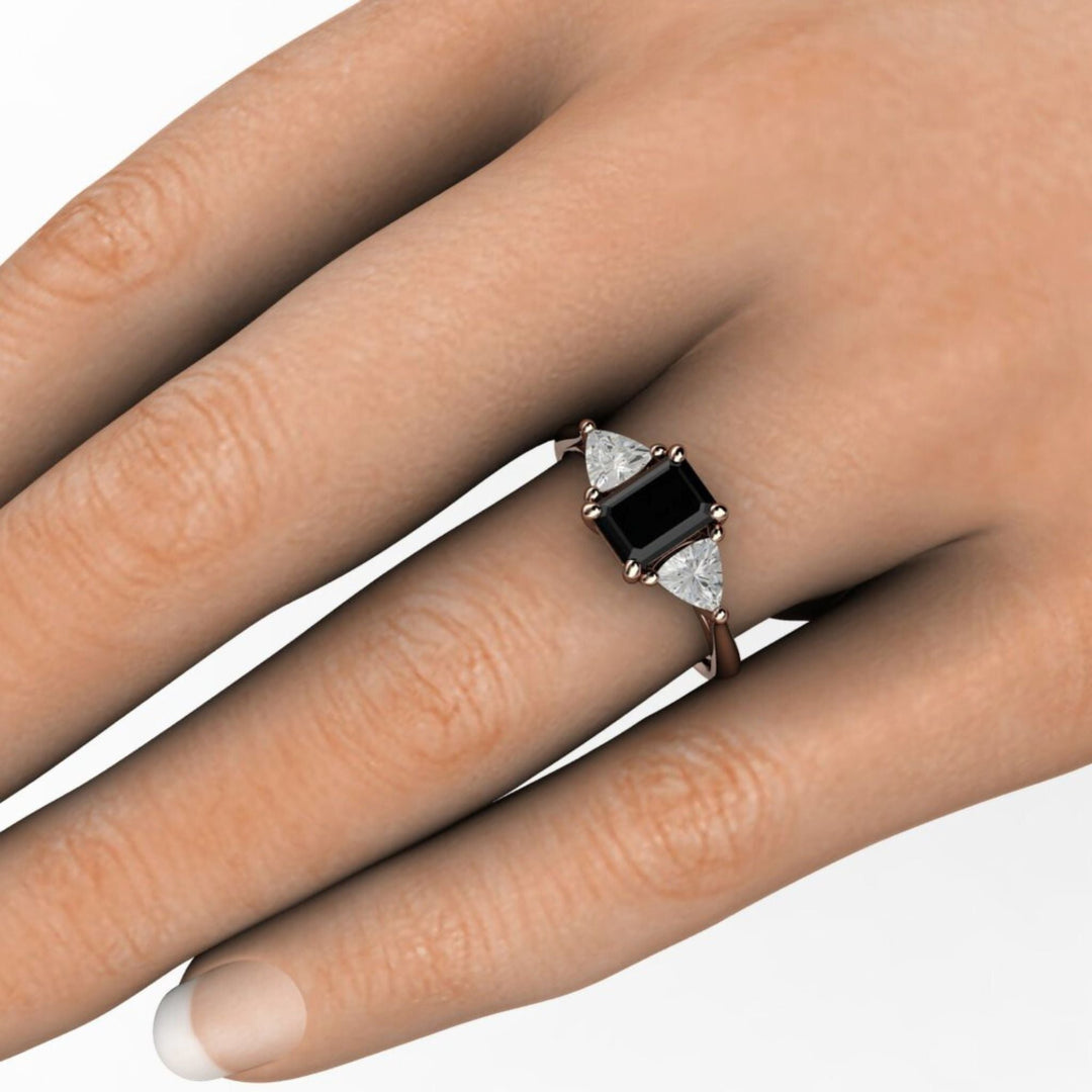 Emerald Cut 3 Stone Engagement Ring with Trillions on the Hand, Black Stone Ring on the Finger