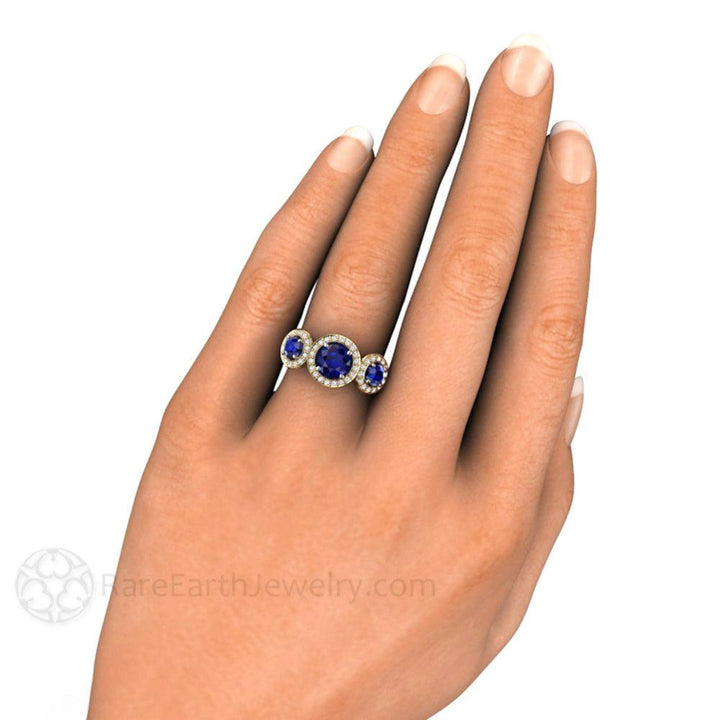 Blue Sapphire Three Stone Engagement Ring, Round Blue Sapphire Ring with Diamond Halo on the Hand