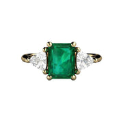 A 3 stone style Emerald cut Green Emerald Engagement Ring with White Sapphire Trillions in Gold or Platinum from Rare Earth Jewelry