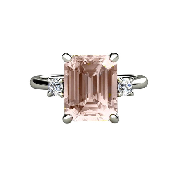 A 3 stone Morganite engagement ring with an Emerald Cut Natural Peach Pink Morganite and Diamonds, a modern classic in Gold or Platinum from Rare Earth Jewelry.