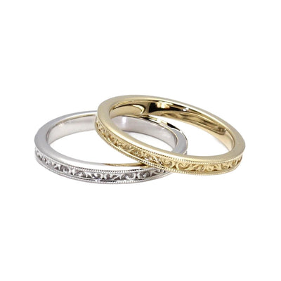 An antique style wedding ring in white or yellow gold.  This band measures 2.5mm and has a vintage style filigree design with a milgrain beaded edge.