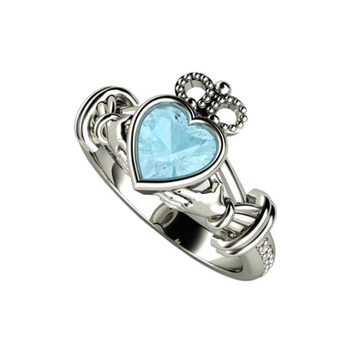 A natural Aquamarine Claddagh Ring an Irish Engagement Ring or Promise Ring in White Gold with a heart cut natural Aquamarine center and diamonds.