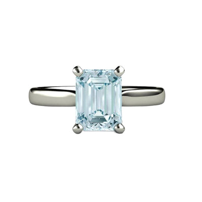 An Aquamarine Solitaire ring or engagement ring with an emerald cut natural Aquamarine in a classic, four prong setting in 14K or 18K Gold.