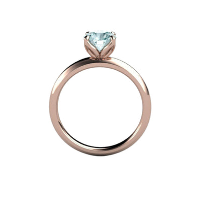 A round natural Aquamarine Ring in a Floral Design Petal Shaped Solitaire Engagement Ring Style in Gold or Platinum, shown in rose gold from Rare Earth Jewelry.