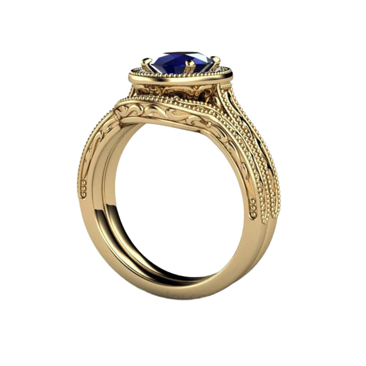 Vintage Style Sapphire Engagement Ring with Engraved Design on Band