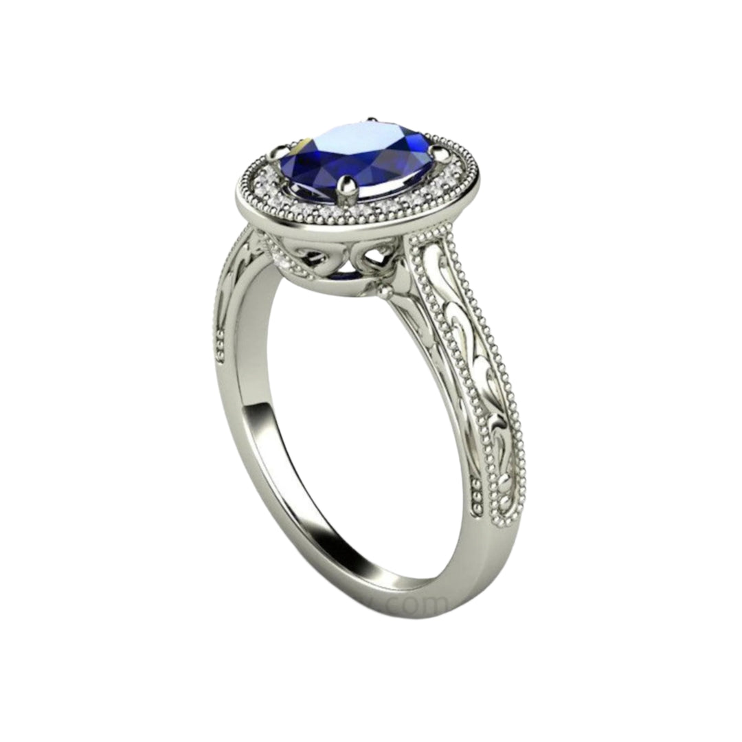 Art Deco Style Oval Sapphire Ring with Diamond Halo, Engraving and Beaded Edge Details.