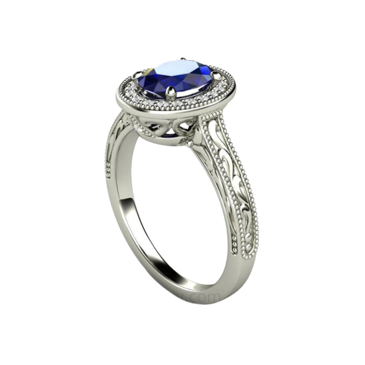 Art Deco Style Oval Sapphire Ring with Diamond Halo, Engraving and Beaded Edge Details.