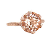 A large round natural Morganite ring with an Art Deco style, a crown design solitaire with filigree and engraving and triple prongs in rose gold.