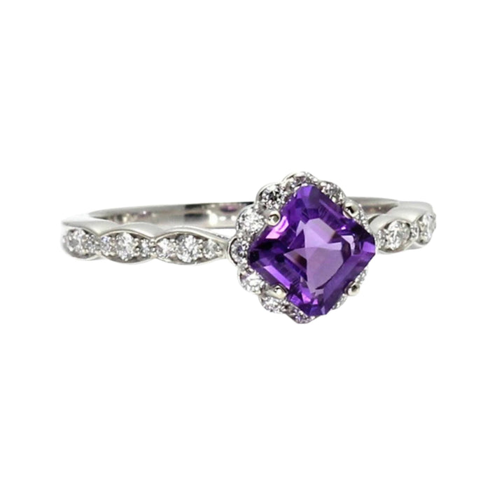 A vintage inspired Amethyst Engagement Ring with Halo of Diamonds, and diamond Accented Shank in Gold or Platinum.