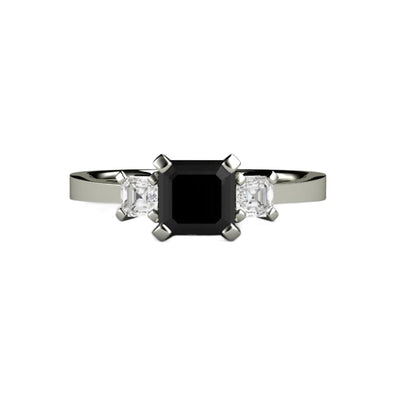 An asscher cut black diamond engagement ring in a three stone style with a modern, contemporary design.