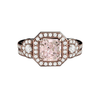An asscher cut natural Morganite engagement ring in a 3 stone style with diamond accents.