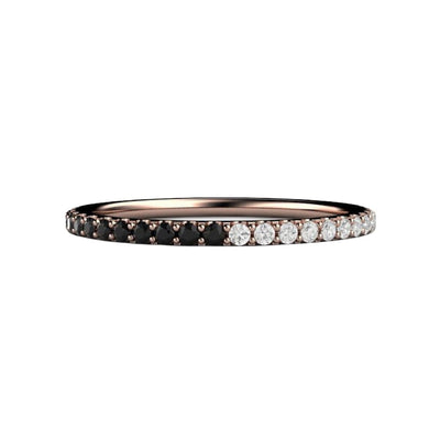 A diamond band with half black diamonds and half white diamonds in a dainty pave setting in gold or platinum, a unique wedding ring or anniversary band..