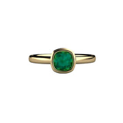 A cushion cut natural blue green tourmaline ring in a simple, modern bezel set solitaire design, shown here in yellow gold. 