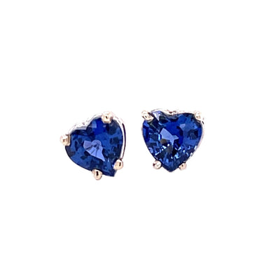 A pair of blue sapphire heart earrings with natural Ceylon blue sapphire heart shaped studs in gold.