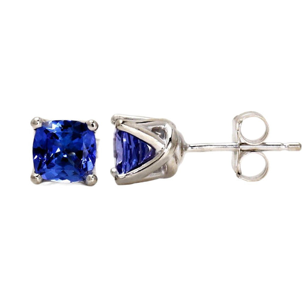A pair of blue sapphire stud earrings with cushion cut lab grown blue sapphires in 14K Gold settings. September birthstone earrings.