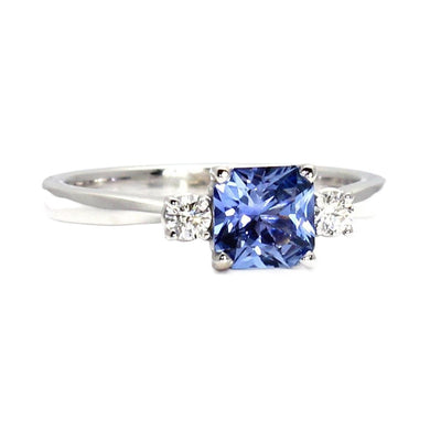An asscher cut blue sapphire engagement ring in a 3 stone style with a 1 carat asscher cut natural blue sapphire from Ceylon, Sri Lanka and diamonds in gold or platinum.