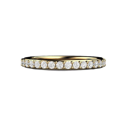 A classic diamond wedding ring with a 2.5mm wide band and prong set natural diamonds in gold or platinum, shown in yellow gold. Stackable.  