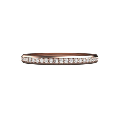 A classic style diamond wedding ring or anniversary band 2mm wide with prong set natural diamonds in gold or platinum, shown here in rose gold.