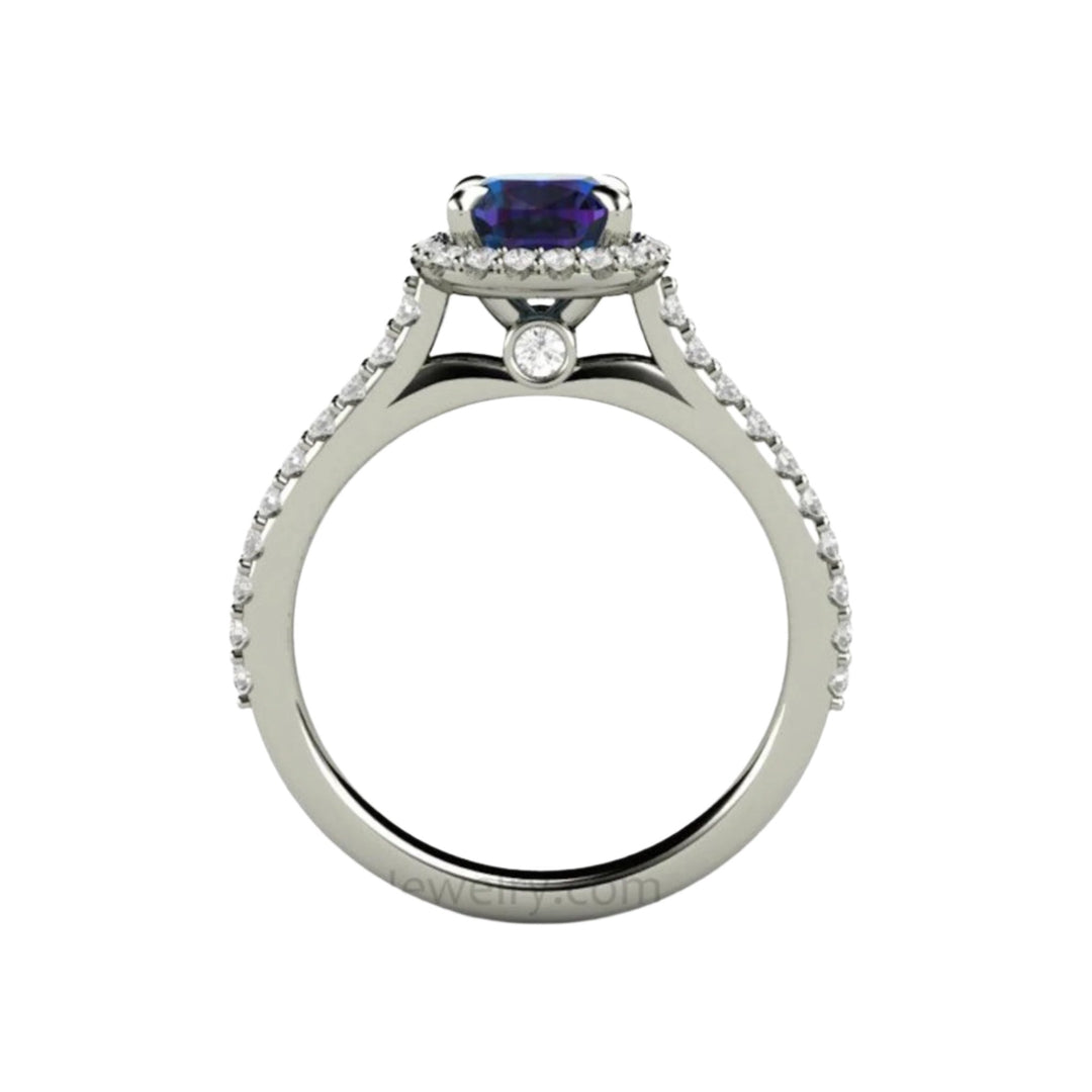 Cushion cut Alexandrite Engagement Ring viewed from the side profile displaying the pave set diamonds and hidden diamond in the gallery