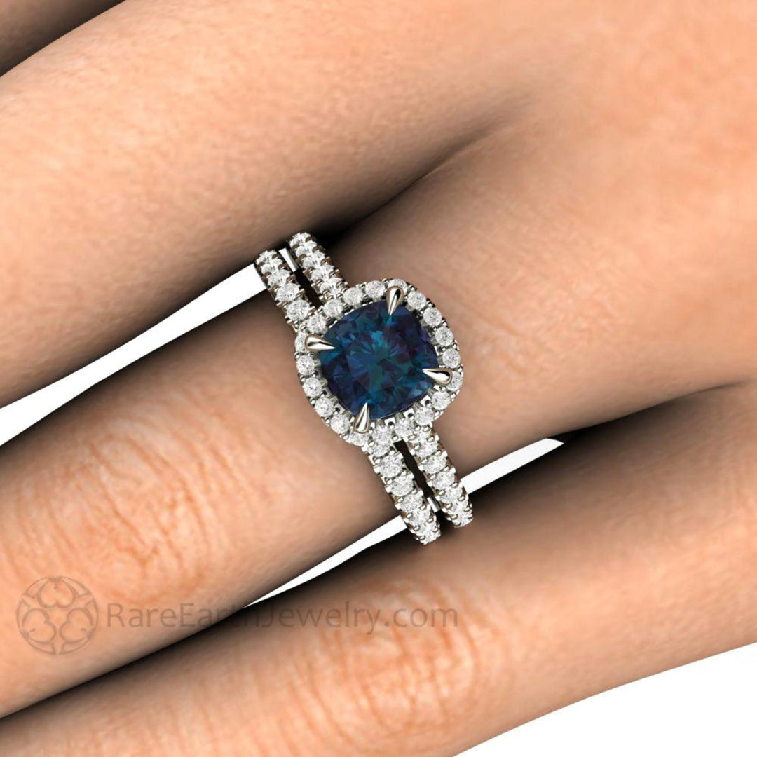 Alexandrite Engagement Ring | Cushion Cut Color Changing Gemstone with Diamond Halo in Gold or Platinum Close Up on the Hand