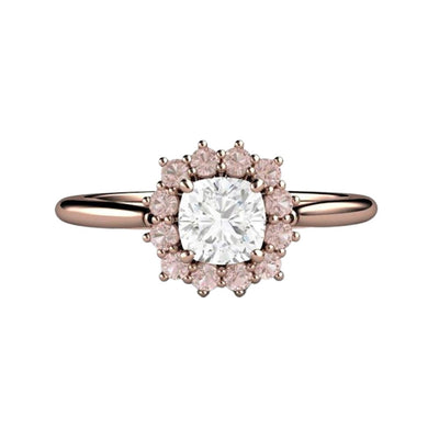 A cushion cut natural Diamond engagement ring with a halo of Argyle light pink natural diamonds in a vintage inspired cluster design, shown here in rose gold.