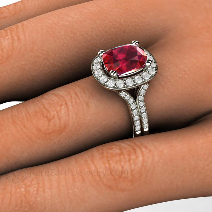 Close Up of Ruby and Diamond Ring on the Finger, Cushion Cut Ruby Ring with Pave Diamond Halo and Split Shank | Rare Earth Jewelry