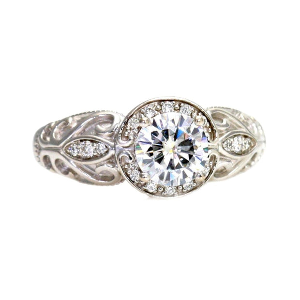 1-carat GIA certified diamond vintage engagement ring with art deco filigree and diamond halo from Rare Earth Jewelry.