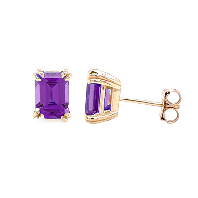 A pair of 14K Gold Amethyst earrings, emerald cut natural Amethyst studs, Purple stone earrings, double prong settings in solid gold.  February birthstone earrings from Rare Earth Jewelry.
