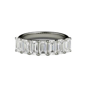 An emerald cut moissanite anniversary band, wedding ring or stackable band from Rare Earth Jewelry.
