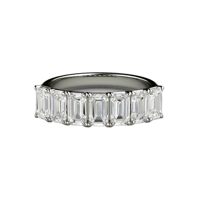 An emerald cut moissanite anniversary band, wedding ring or stackable band from Rare Earth Jewelry.
