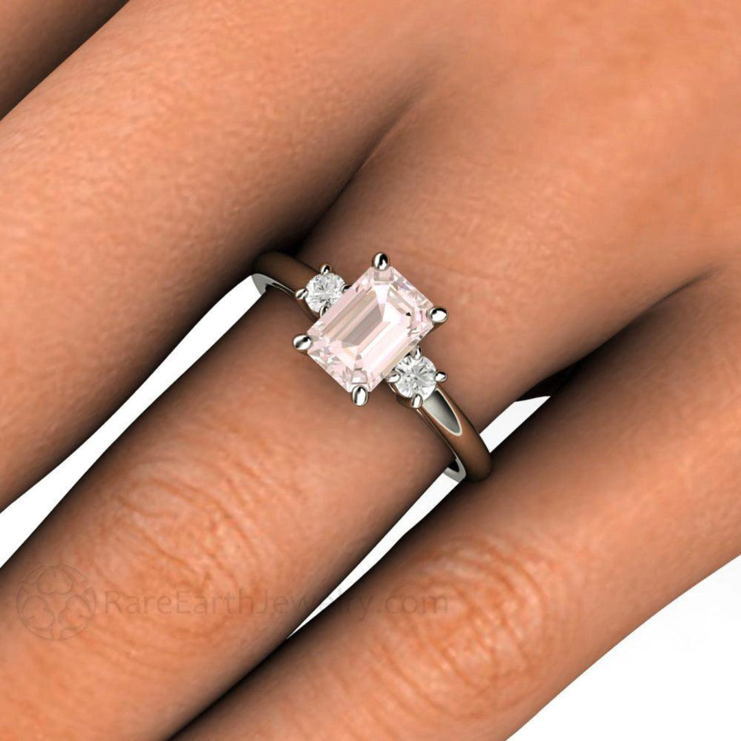 7x5 Emerald Cut Morganite Engagement Ring, 3 Stone with Diamonds, Close Up on the Finger