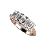 A natural White Sapphire ring featuring five emerald cut white sapphires, a unique wedding band or 5 year anniversary band or stacking ring, shown in rose gold.. 
