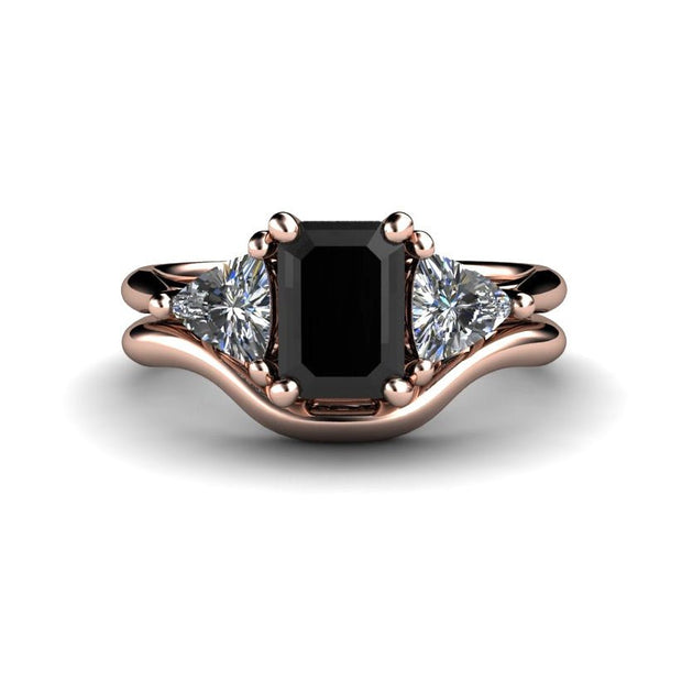 An Emerald Cut Black Diamond Engagement Ring with Diamond Trillions and matching contoured wedding band Wedding Set in rose gold from Rare Earth Jewelry.