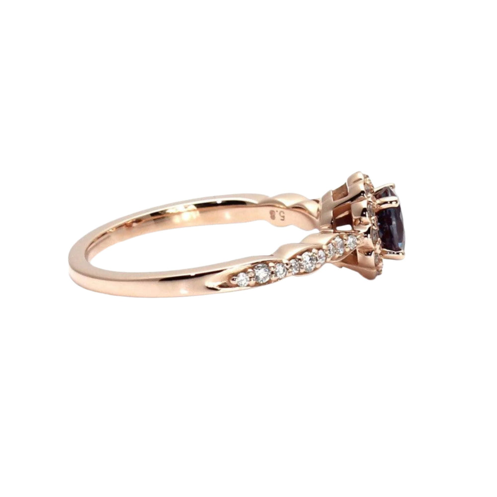 Vintage Style Alexandrite Engagement Ring in Rose Gold viewed from the side featuring scalloped band with diamonds