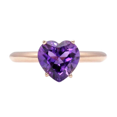 A large purple amethyst heart shaped ring in rose gold.  This heart cut natural Amethyst ring is a vivid purple color, February birthstone ring from Rare Earth Jewelry.