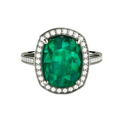 A large cushion cut Emerald ring, engagement ring or statement ring with a 10x8mm lab created Emerald and pave set diamonds in gold or platinum from Rare Earth Jewelry. 