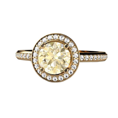 A pretty pastel yellow Lemon Quartz Engagement ring with a diamond halo available in gold or platinum from Rare Earth Jewelry.