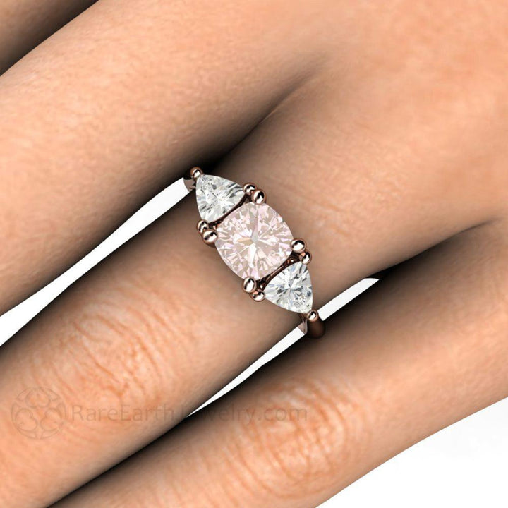 3 Stone Light Pink Sapphire Cushion Cut Ring with White Sapphire Trillions, Close Up on the Finger