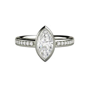 A Moissanite marquise cut engagement ring with a 1ct Forever One Moissanite in a modern, minimalist bezel set solitaire setting available in gold or platinum from Rare Earth Jewelry