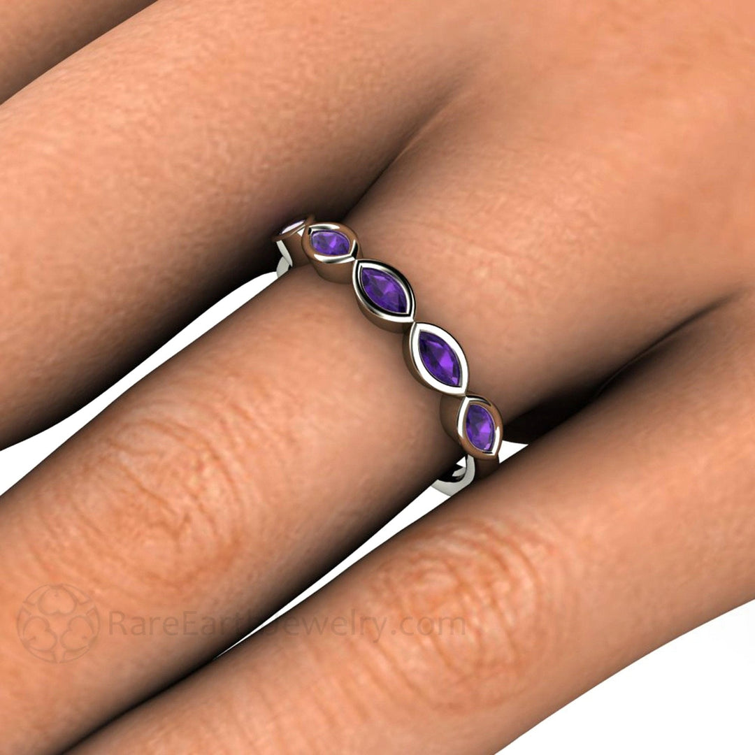 Close up of the modern marquise cut Amethyst ring shown on the hand